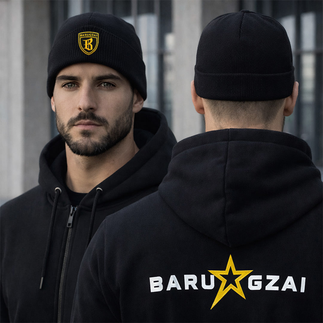 Male Cuffed Beanie on a male model on a lifestyle shot with an urban background. The rear view on the side has the hoodie on and the rear of the beanie.