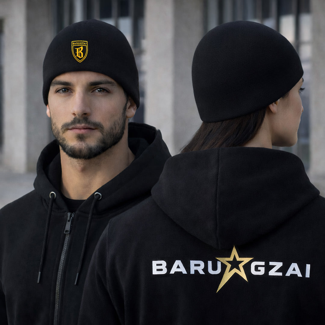 Man and woman wearing black hoodies with 'BARU GZAI' branding outdoors. they have the cuffless barugzai beanie on as well.