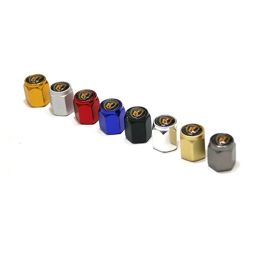 Set of colorful metal valve stem caps on a white background