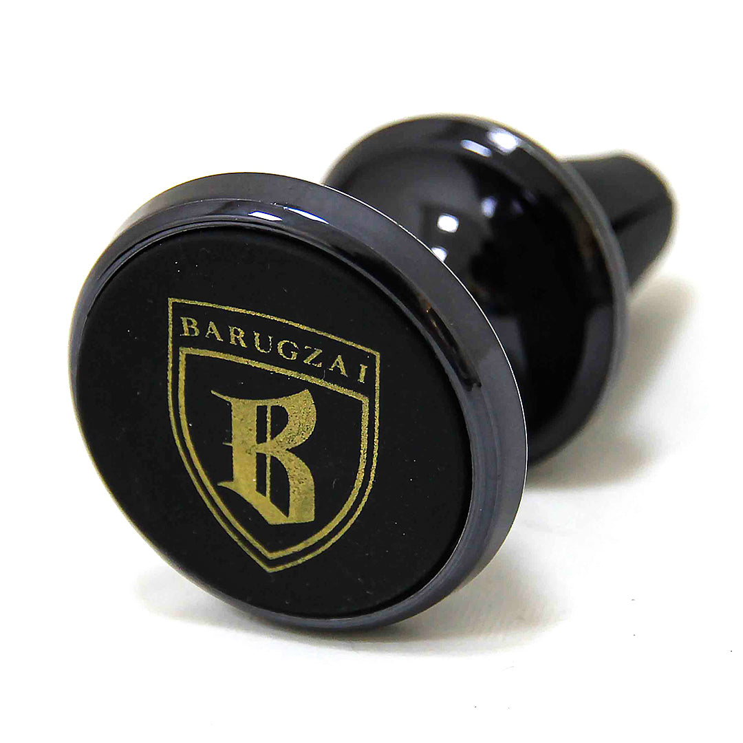 Black Magnetic Placeholder for the phone with gold logo and text on a white background in a front quarter angle.