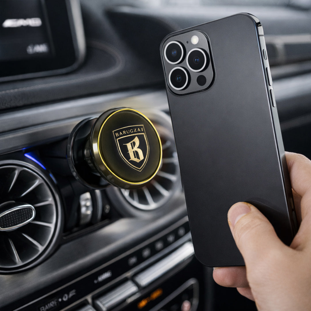 Hand holding a smartphone with a car magnetic placeholder mounted in a vehicle's air vent.