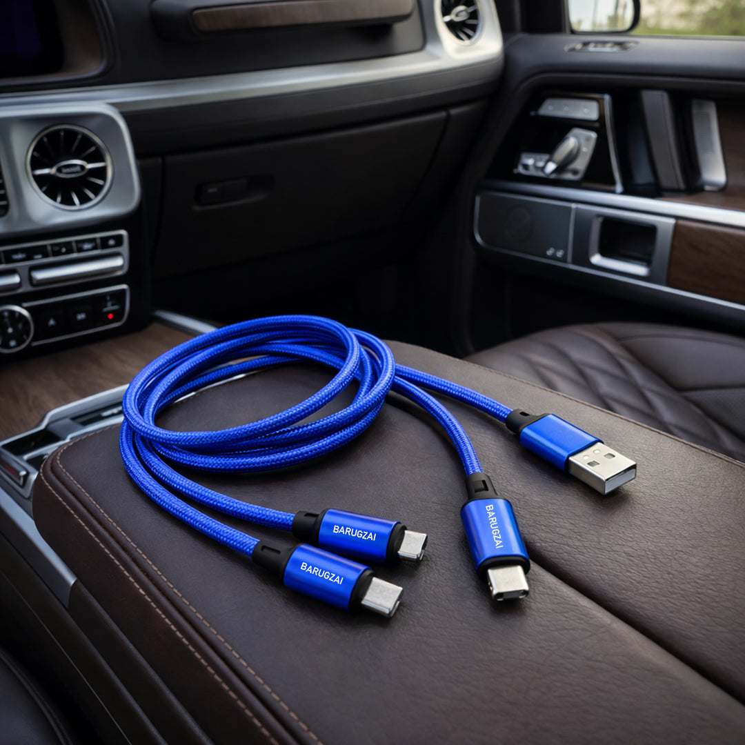 Velocity Blue 3-in-1 Barugzai USB cable with connectors on a car interior.