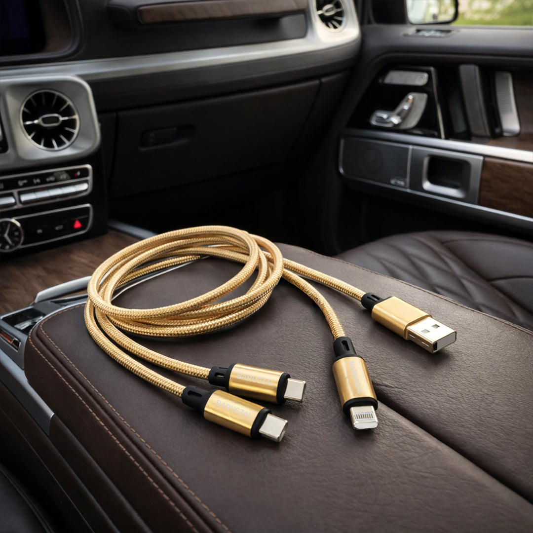 Golden Multi-device charging cable on a car console.