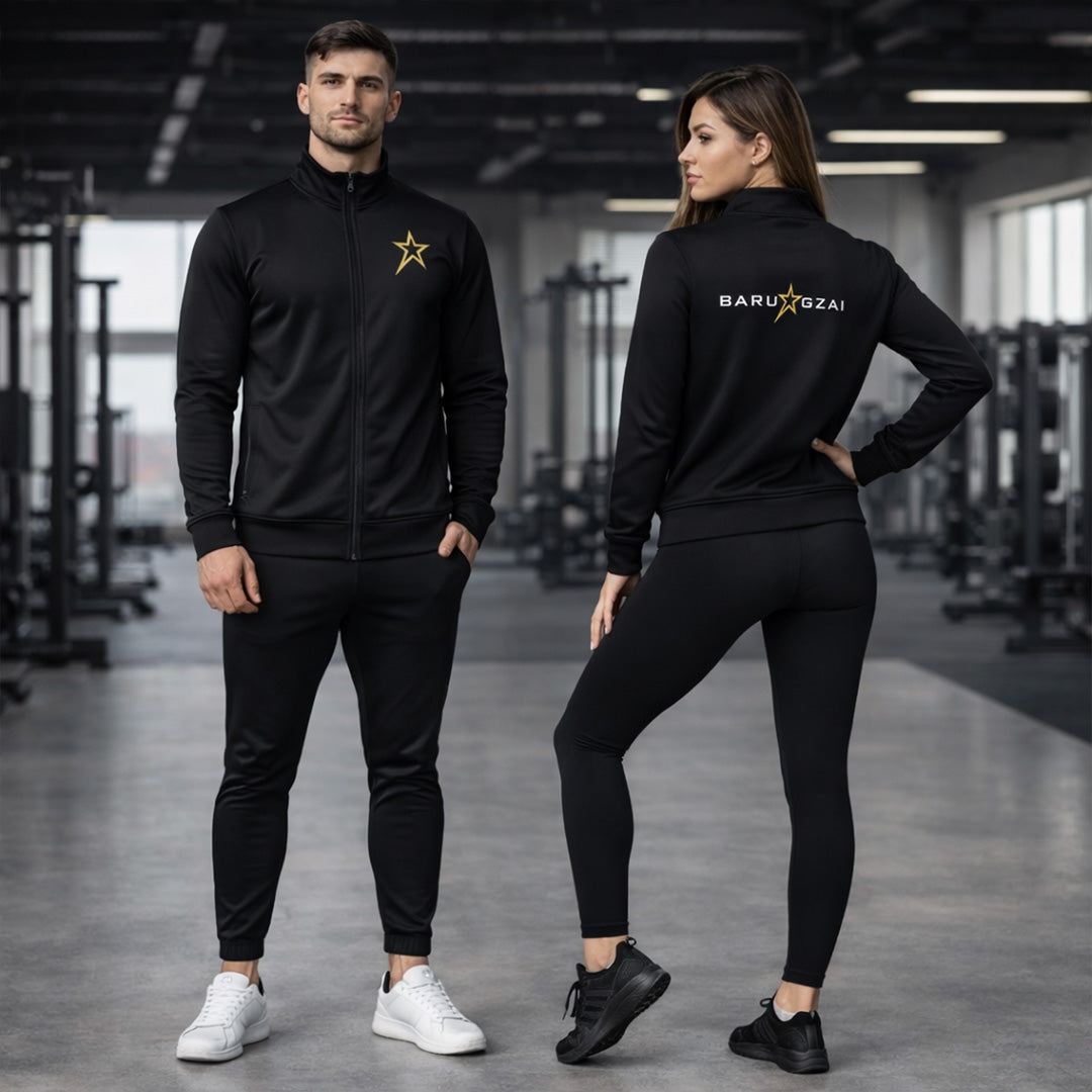 Two people wearing black athletic wear with visible branding in a gym setting.