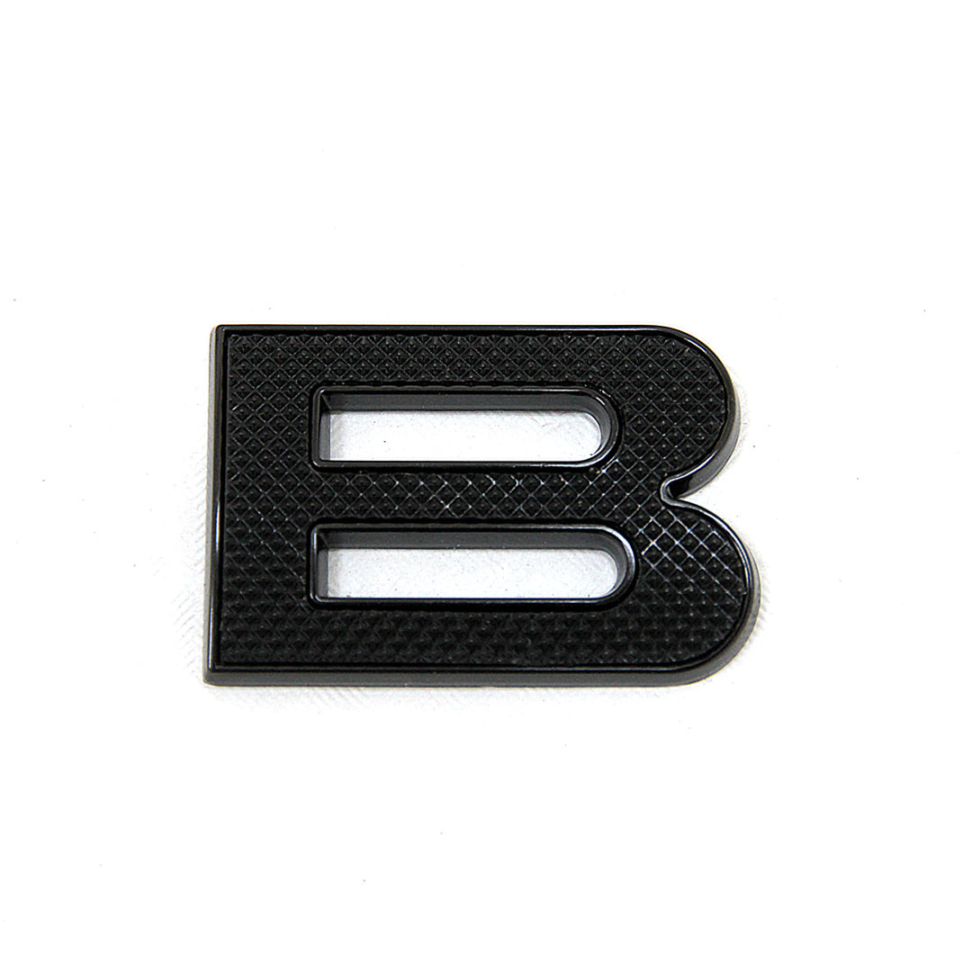 Black ltexture with black border letter 'B' lettering on a white background