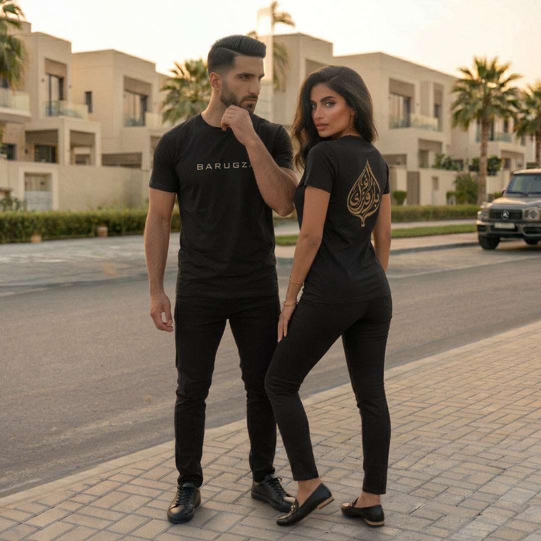 Barugzai Arabic capsule t-shirt worn by male and female models outdoors