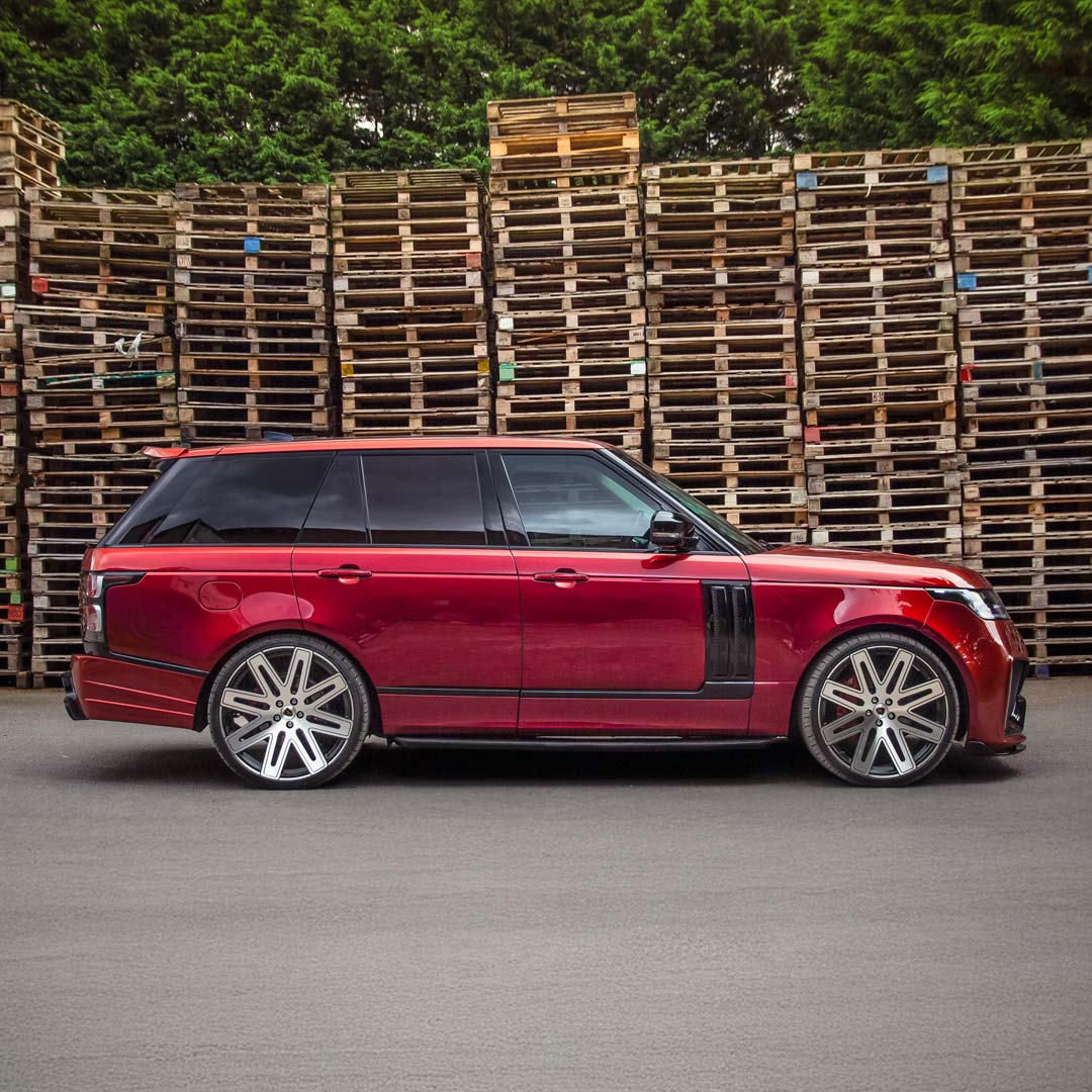 Full side profile hero angle of the Red Range Rover Vogue showcasing the Barugzai Bison styling kit.