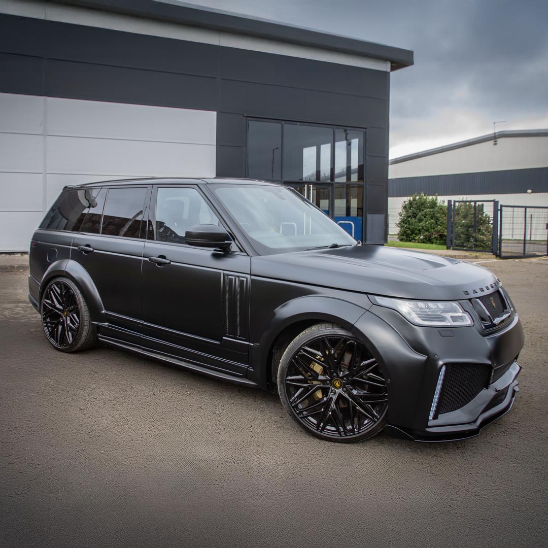 Satin Grey Range Rover Bison II Wide Bodykit front quarter long view showcasing the bold stance and extended arches by Barugzai.