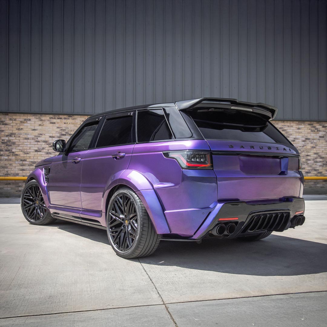 Purple Rear quarter view featuring wide stance, rear apron, and tailgate spoiler details.