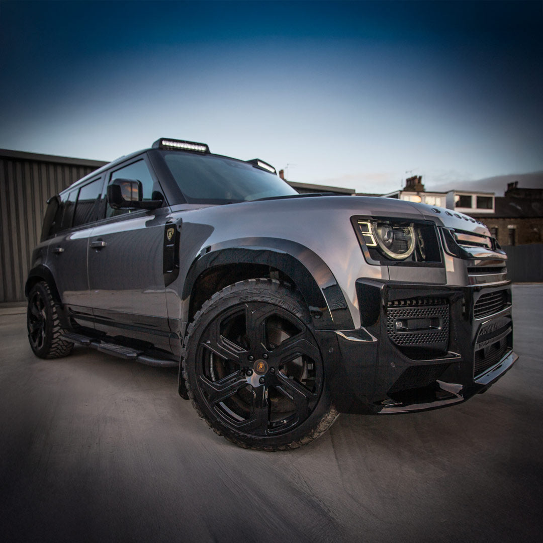 Barugzai Sabre 22 inch gloss black wheels installed on custom Land Rover Defender 110 Barugzai Falcon build.
