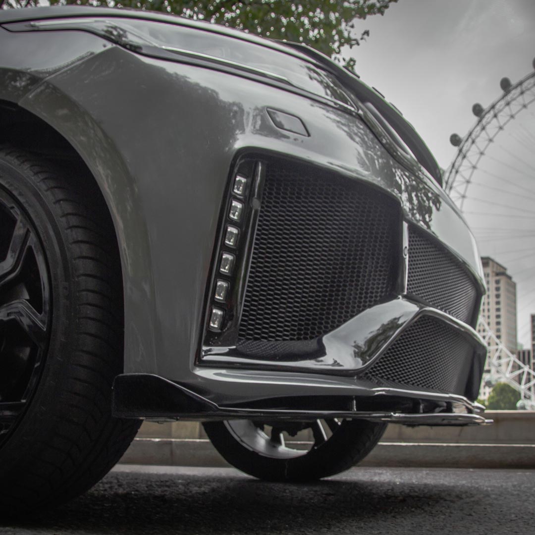 Front splitter detail from Huntress Bodykit emphasising sporty styling and performance-inspired look.