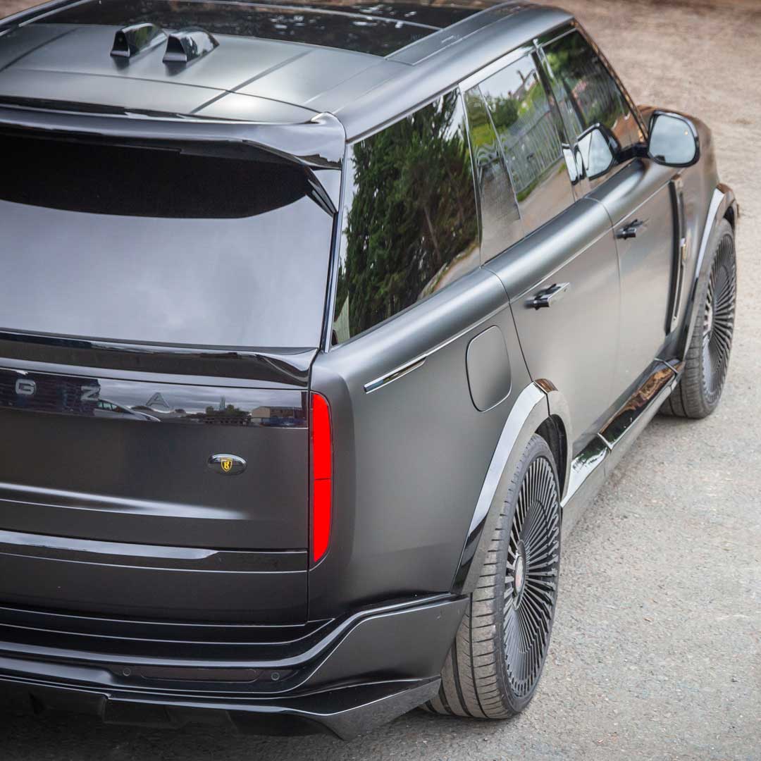 Black Barugzai Nebula Widebody Kit rear roof spoiler, mid spoiler and luxury branding detail on Range Rover L460
