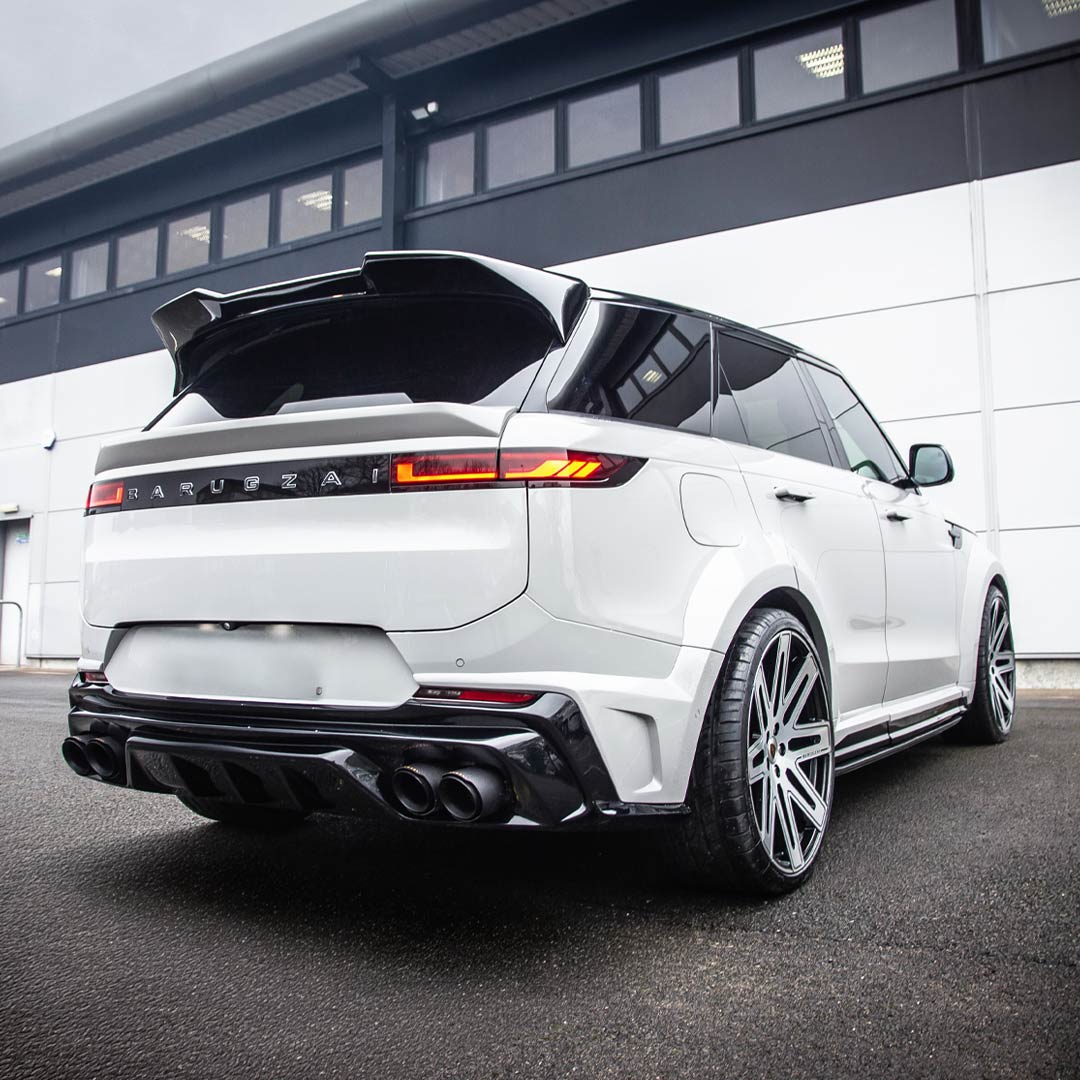Nardo Grey Barugzai Raptor Body Kit on Range Rover Sport L461 – rear quarter hero shot with wide arches fitted with EXEL wheels in Gloss Black Polished Face