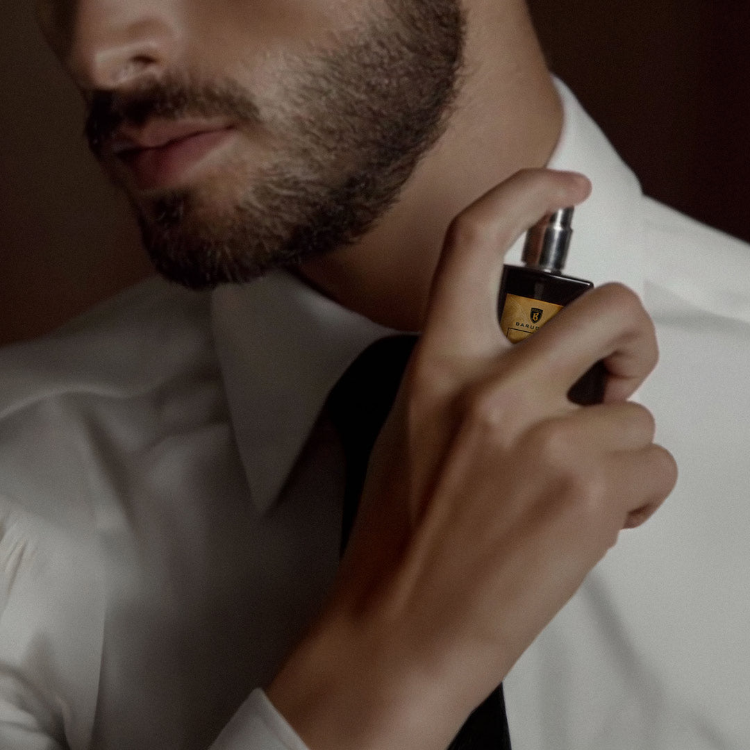 Barugzai Oud Royal fragrance being applied to neck in intimate lifestyle setting