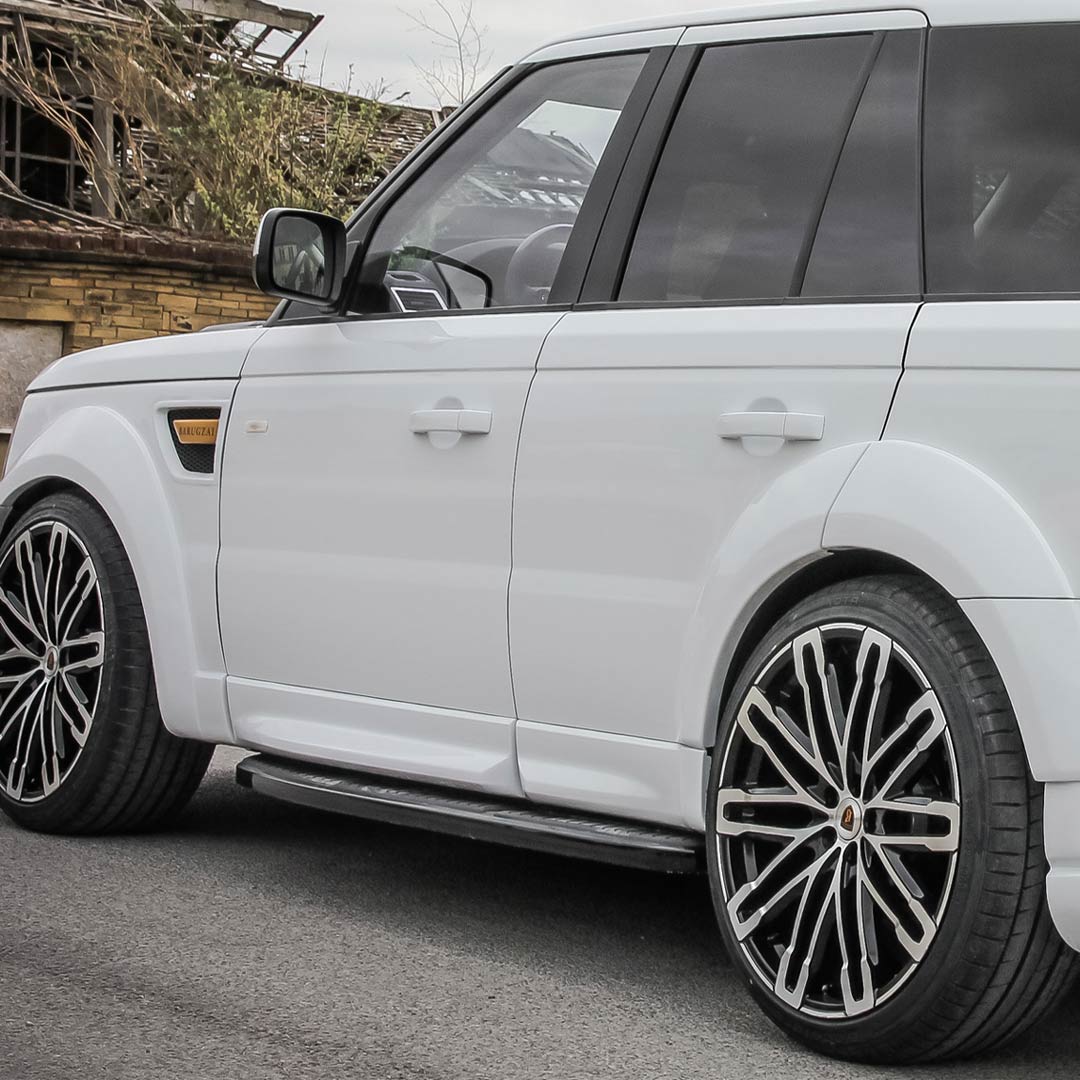 Detail shot of Classic Sport 320 lower door mouldings and wheel arch design on white L320