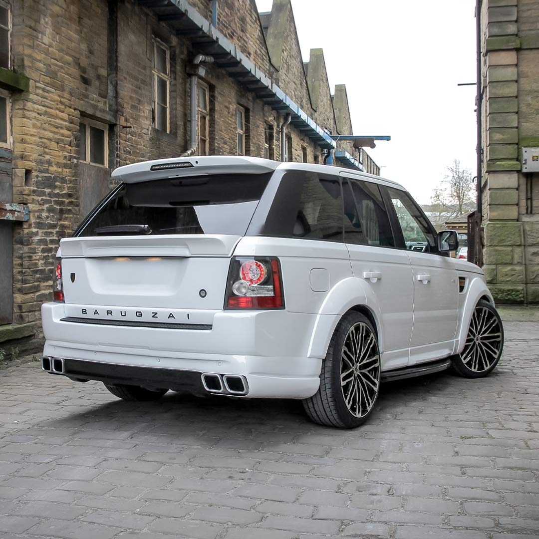 Rear quarter hero shot of white Range Rover Sport L320 featuring Classic Sport 320 rear bumper and diffuser