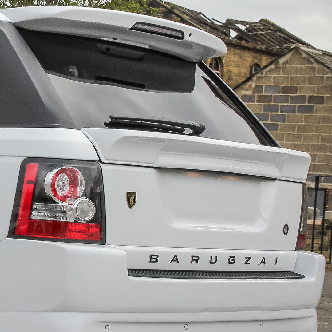 Detail shot of Classic Sport 320 rear spoilers and Barugzai branding on white Range Rover Sport L320