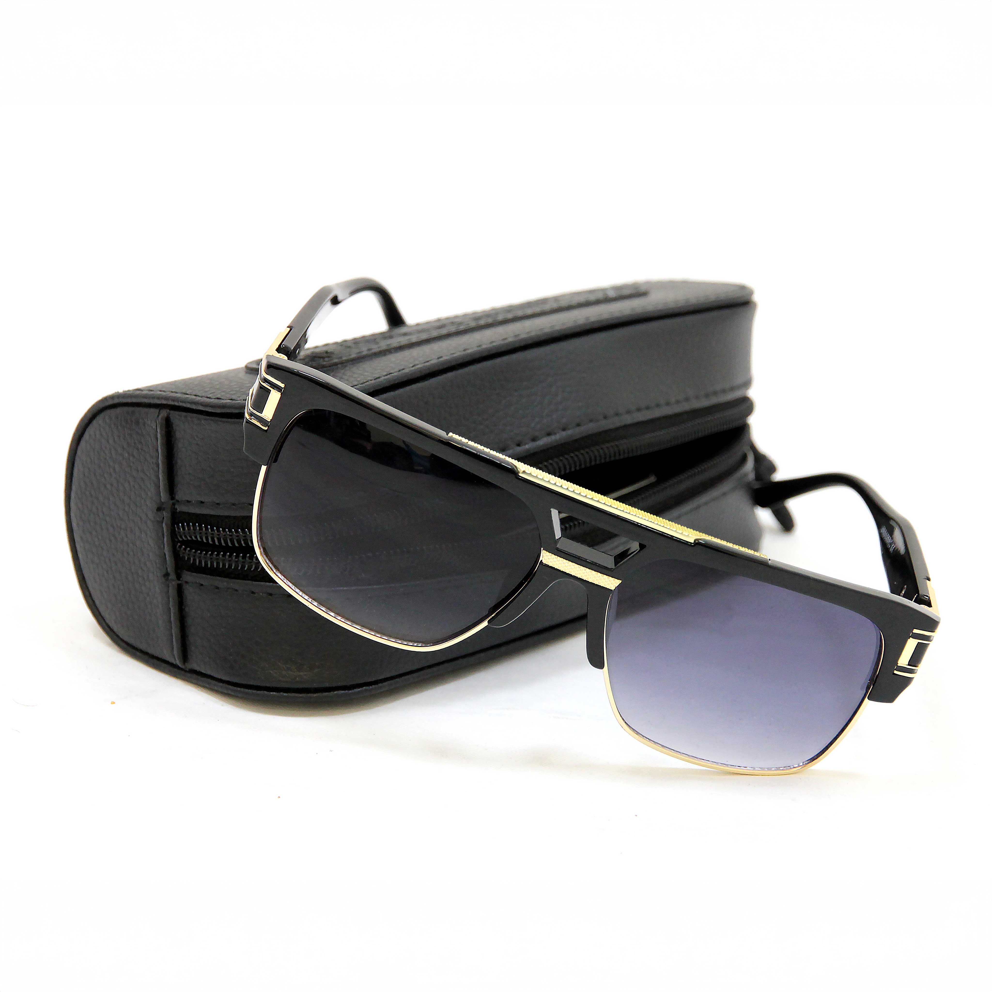 Black sunglasses with gold frame on a white background