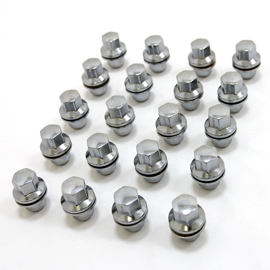 Set of Chrome metal wheel bolts on a white background.