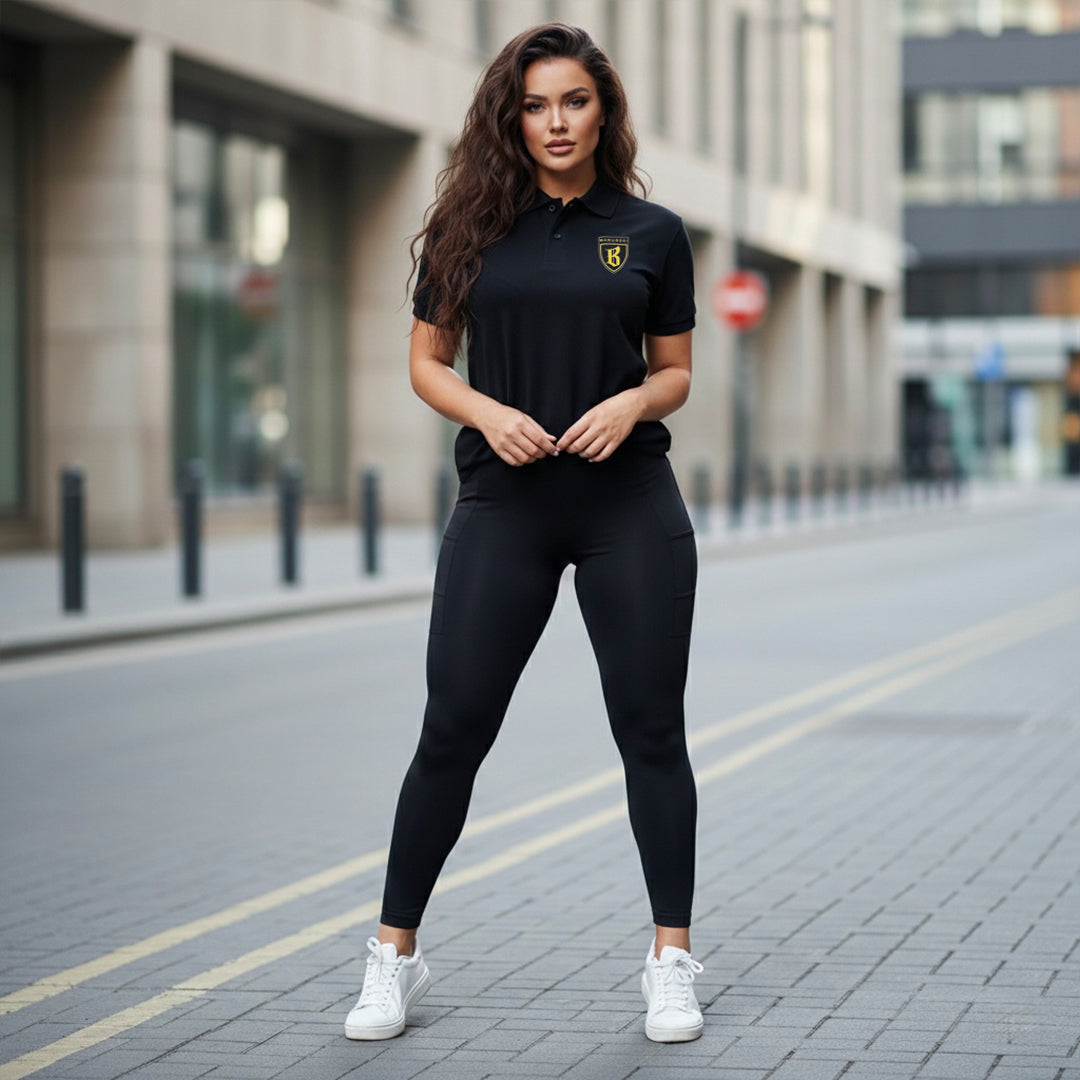 Barugzai women black gold shield polo athletic fit front view.