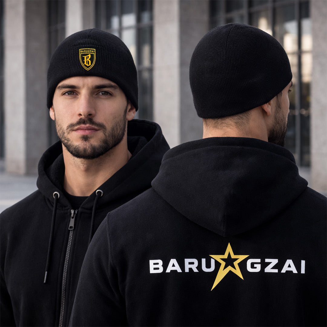 Man wearing a black hoodie and beanie with 'Baru Gzai' branding with a star right in the middle, standing in front of a building.