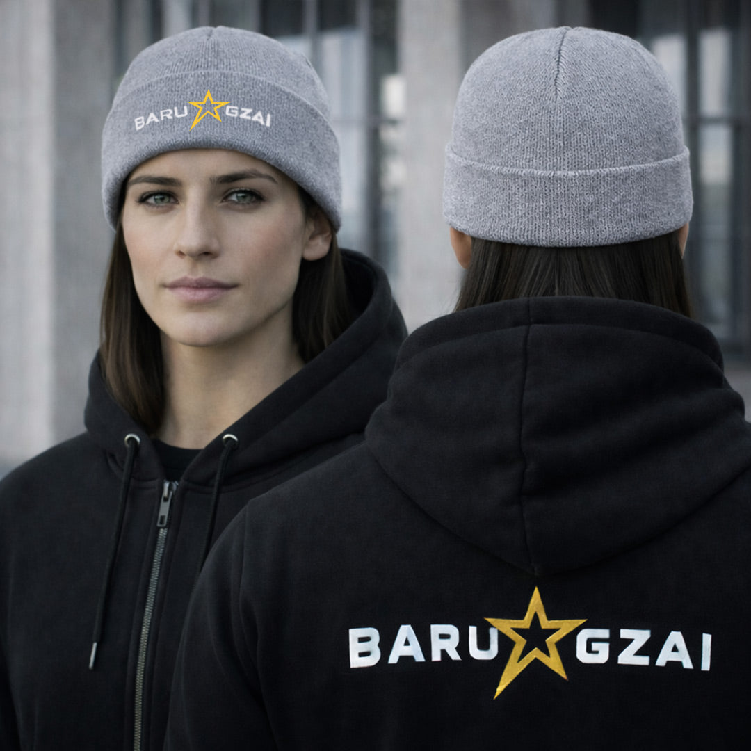 Female wearing grey barugzai star logo folded beanie with barugzai branding on a urban street. 