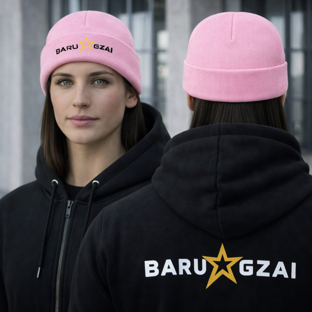 Woman wearing a pink beanie and black hoodie with 'BARU GZAI' branding.