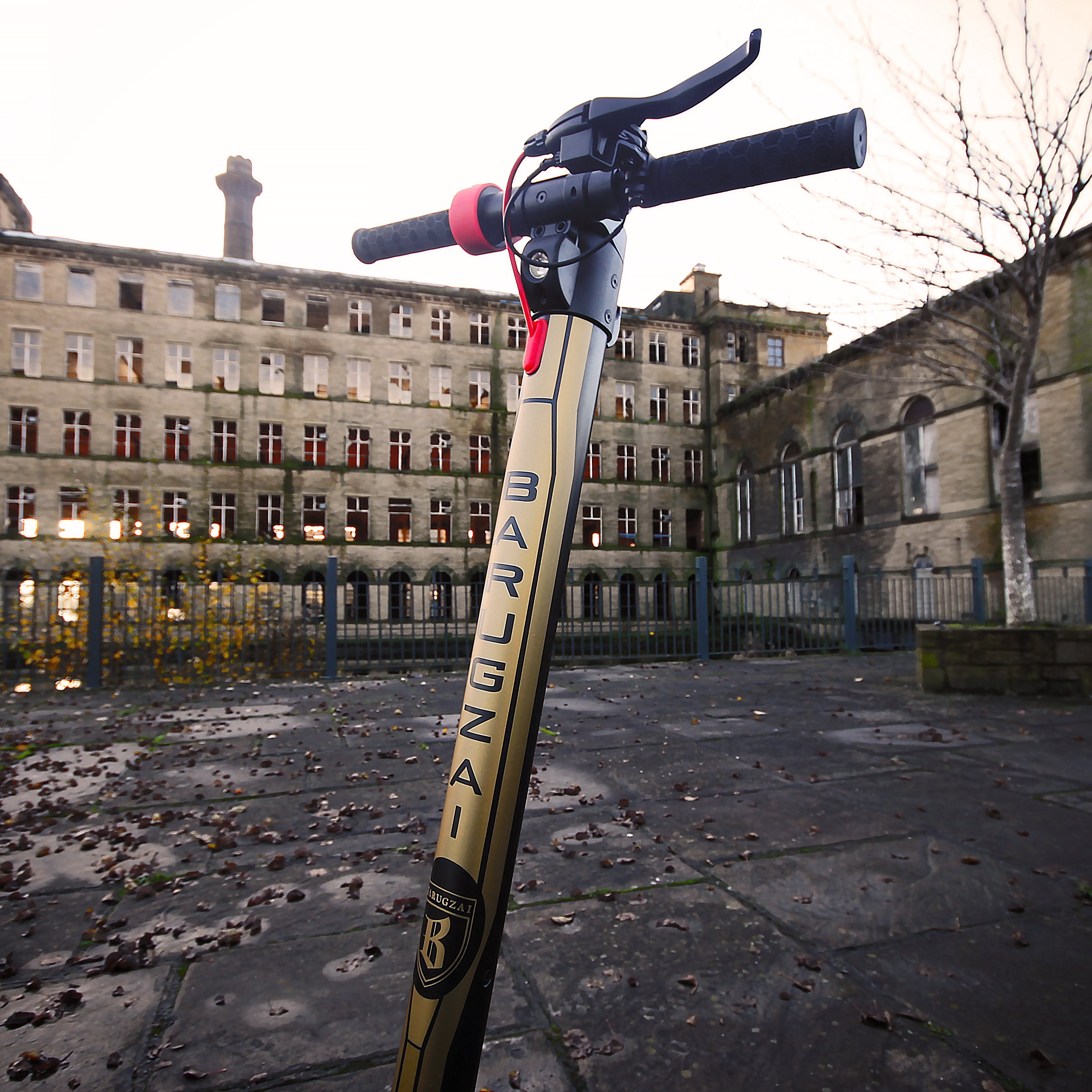 Pole with 'Anvil' branding in front of a derelict building