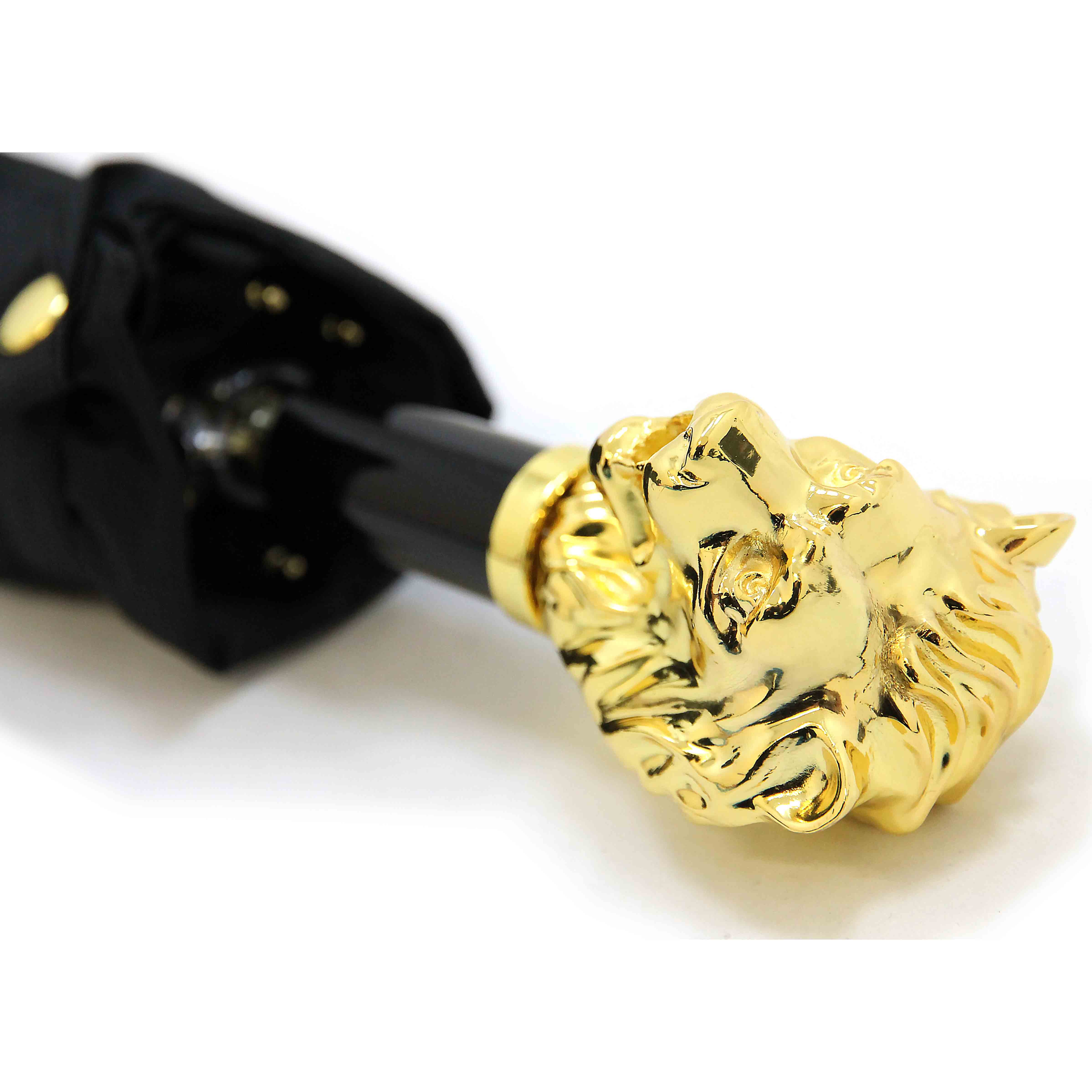 Gold lion head umbrella handle on a white background