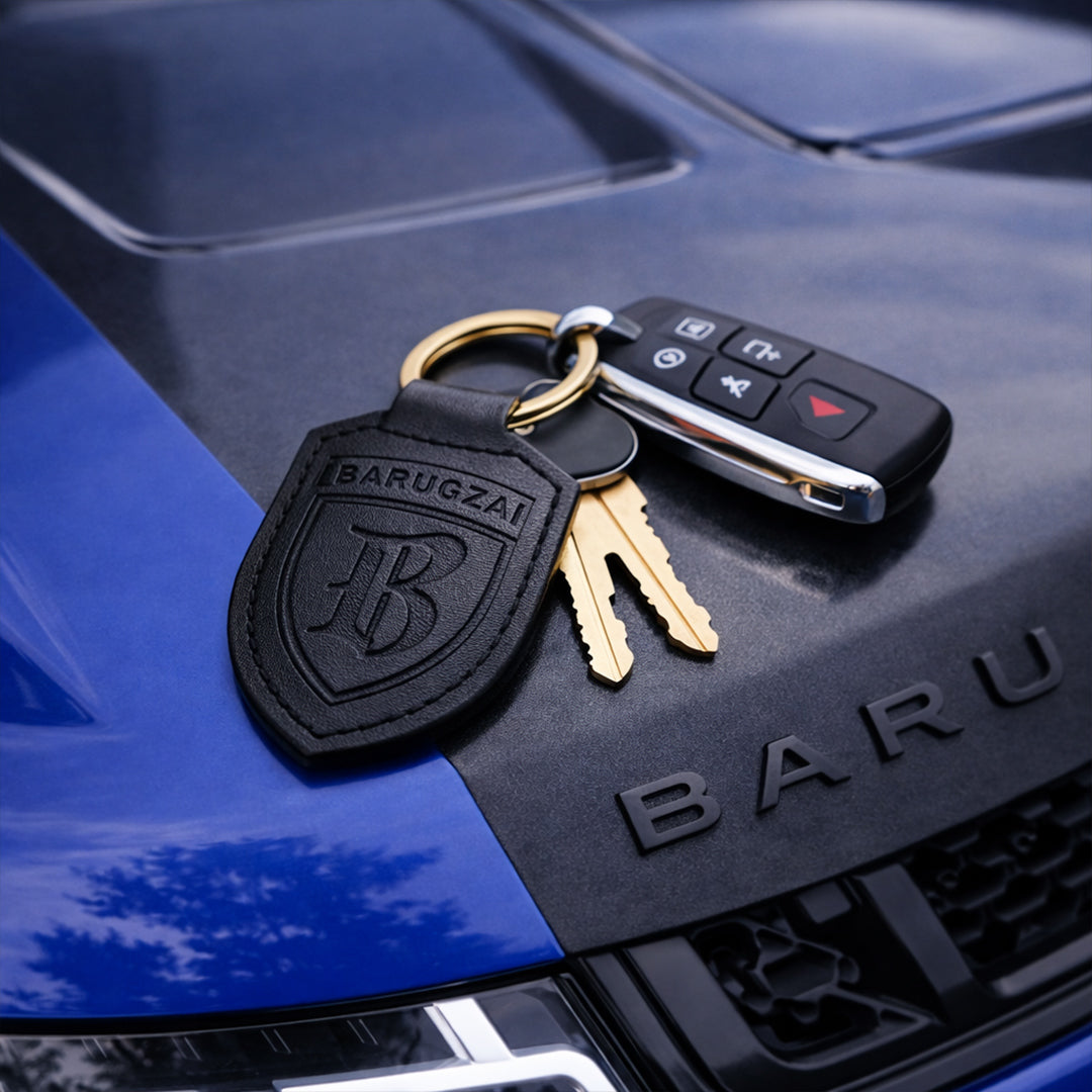 Black Leather Barugzai Key Chain with the keys and fob on the hood of a barugzai range rover sport bonnet. 