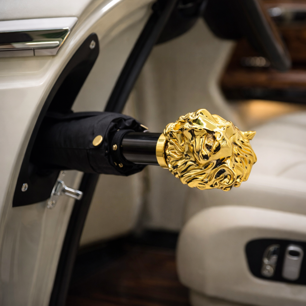 Gold lion head car emblem attached to a vehicle.