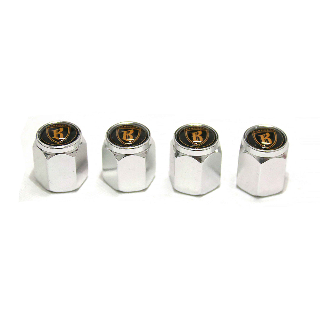 Four chrome valve stem caps with a logo on a white background