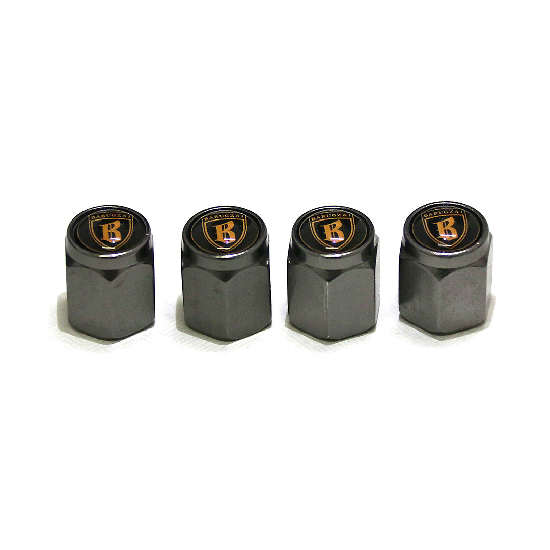 Four grey tire valve caps with a logo on a white background