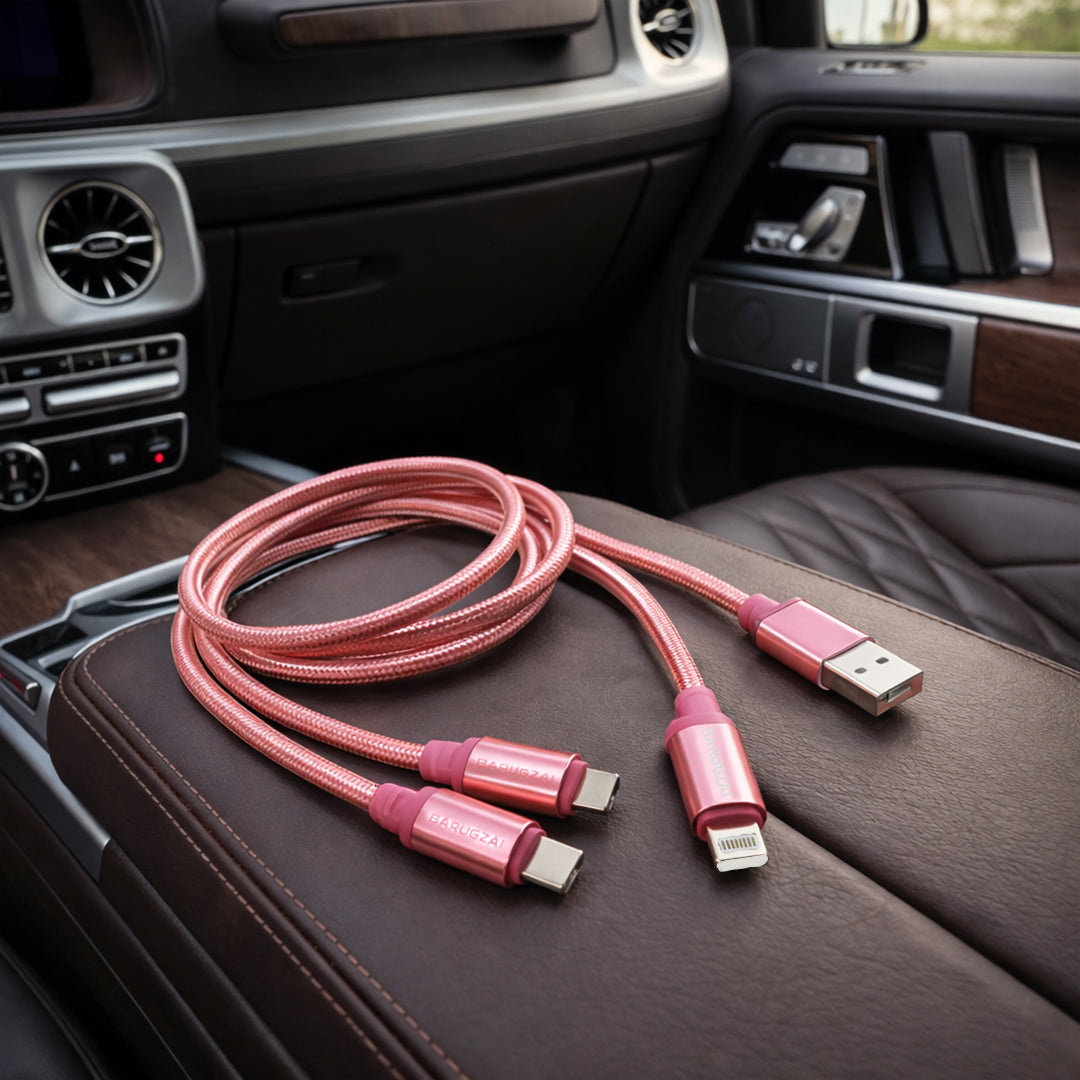 Pink 3-in-1 Charging Cable charging cable on a car interior.