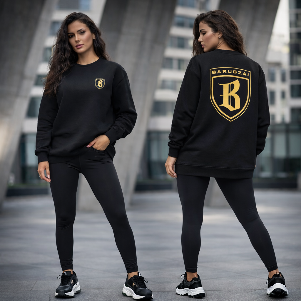 Woman wearing a black barugzai black jumper with a logo, standing in an urban setting.