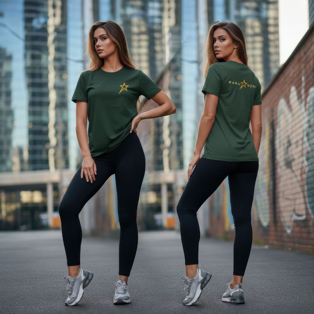 Female model wearing Green Barugzai Essentials B-Star lightweight t shirt in an urban setting. 