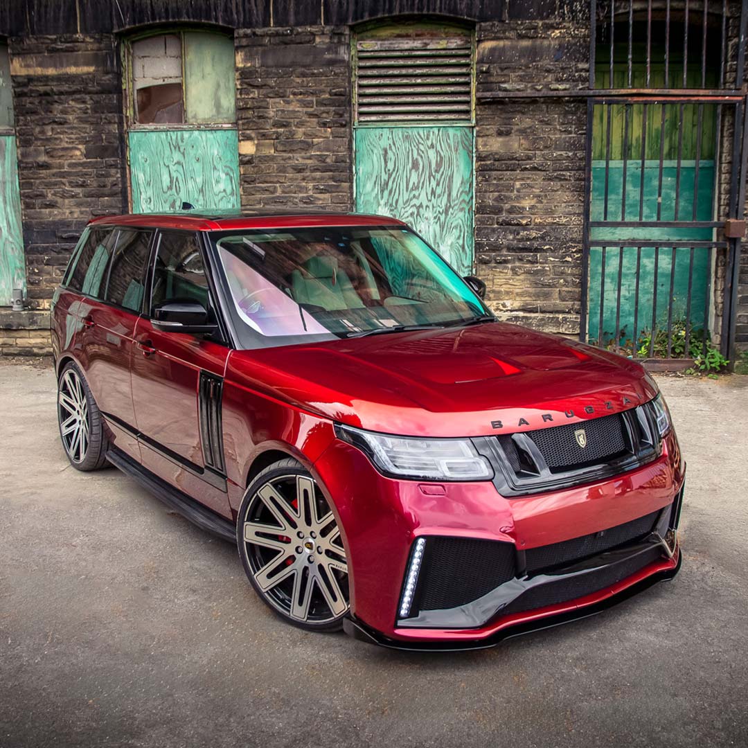 Dynamic front quarter hero shot of the Red Range Rover Vogue fitted with the Barugzai Bison kit.