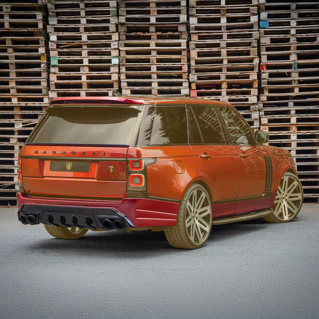 Rear quarter hero shot of the Red Range Rover Vogue, emphasising Bison kit width and rear design, components revealed