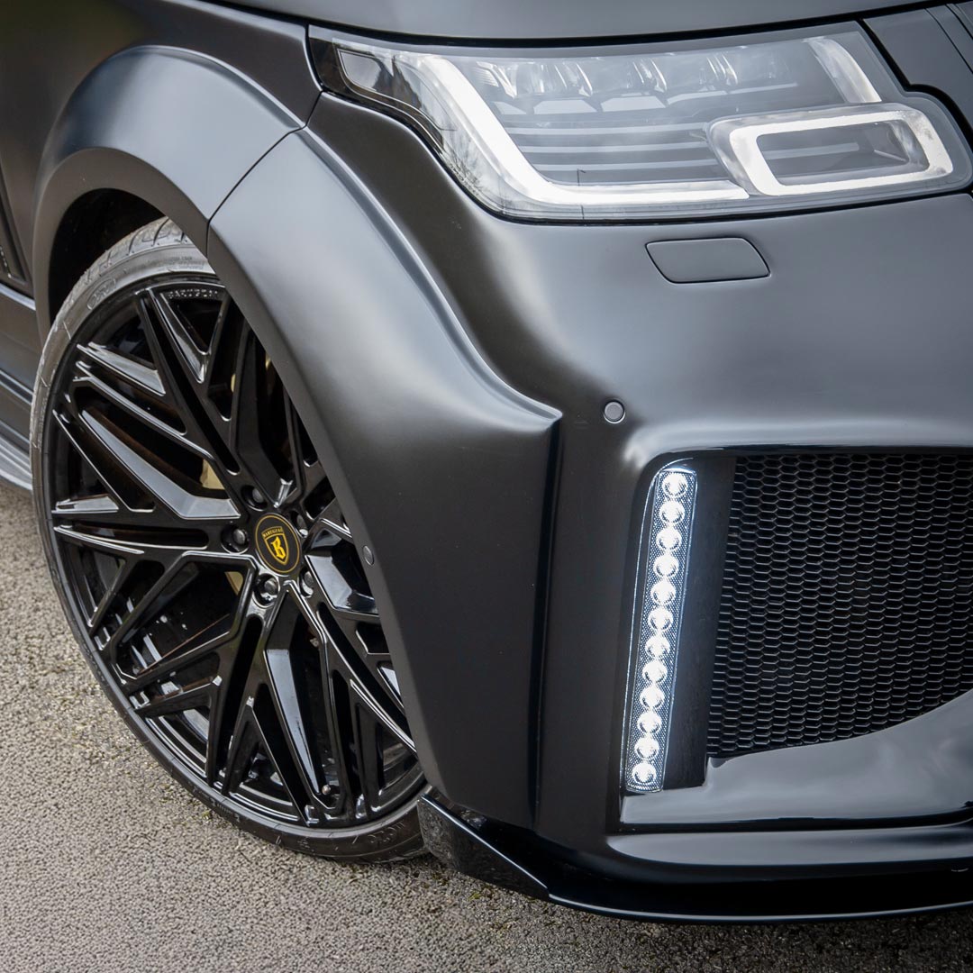 Close-up of the Satin Grey Bison II Wide front apron showing deep intakes, sharp edges, and luxury surface finishes.