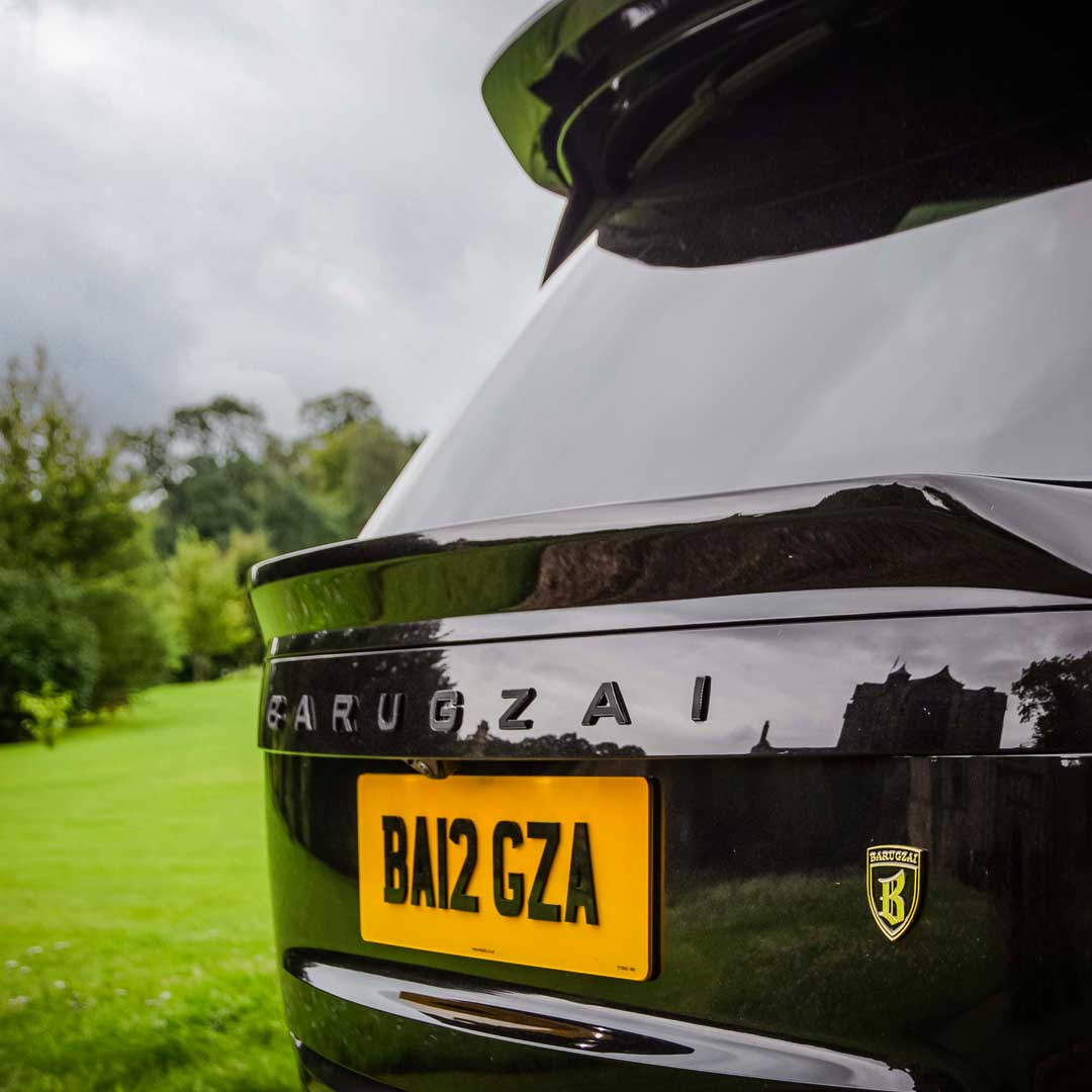 Black Barugzai Nebula Body Kit rear roof spoiler, mid spoiler and branding detail on Range Rover L460