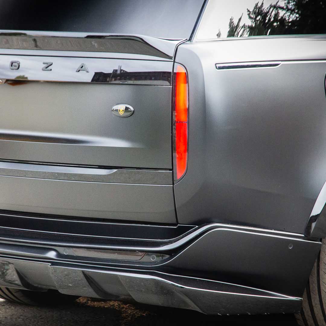 Black Detail view of Barugzai Nebula Widebody Kit rear apron diffuser and extended design on Range Rover L460